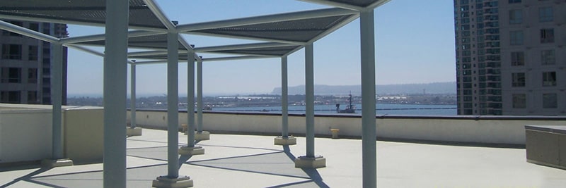 A plaza deck roofing system by Garland with a blue sky background.