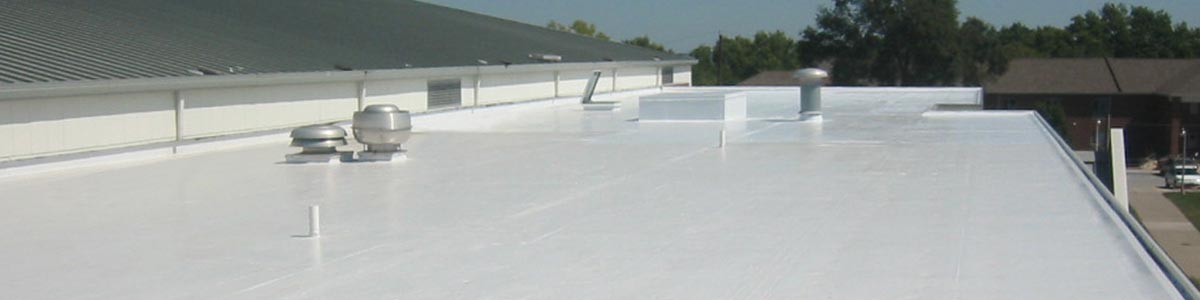 A roof with a coat of white reflective roof coating from Garland.